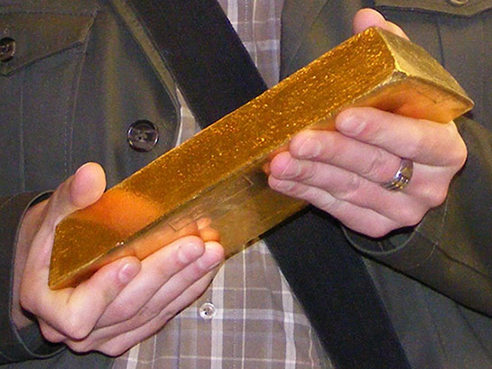 Man Holds Very Large Gold Bullion Bar